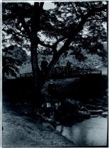 Two priests and a boy by a bridge, Moanalua Gardens, Oahu.